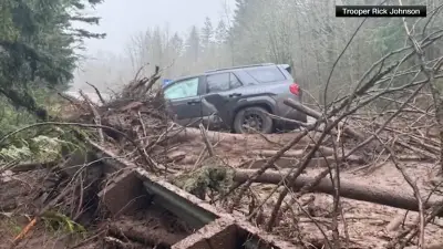 Tens of thousands ordered to flee flooding after torrential rain in Pacific Northwest